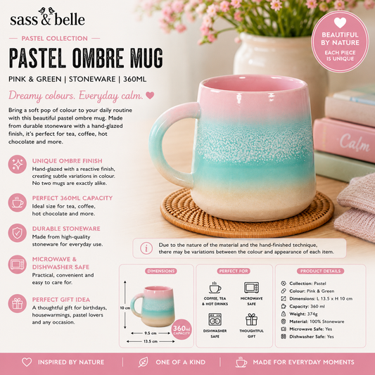 Pastel ombre mug with pink and green gradient on a table with a vase and towel in the background.