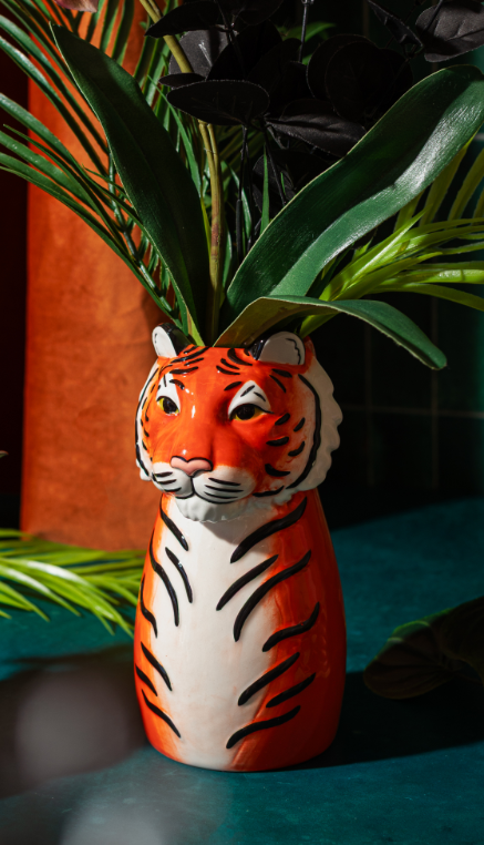 Orange tiger decorative vase with flowers