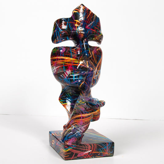 Colourful abstract face sculpture from The Leonardo Collection, featuring a vibrant graffiti-style design with a finger pressed to the lips in a "silence" gesture.