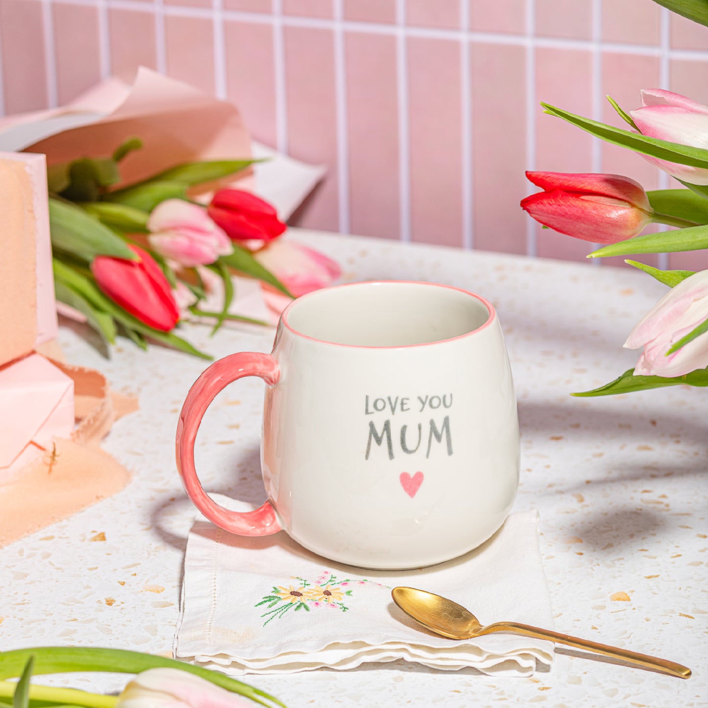 Love You Mum Mug displayed with flowers – Sass & Belle Mother’s Day Gift