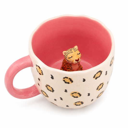 Sass & Belle Surprise Leopard Mug showing hidden leopard figurine inside pink interior